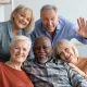 happy-elderly-people-taking-selfie-together-home-interior_116547-16776